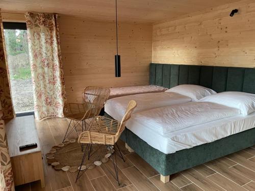 En eller flere senge i et værelse på Glamping Challet Slunečno Český ráj