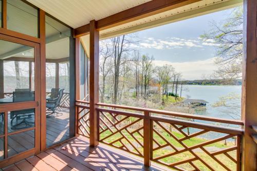 a screened porch with a view of the water at Smith Mountain Lake Getaway with Private Dock! in Moneta