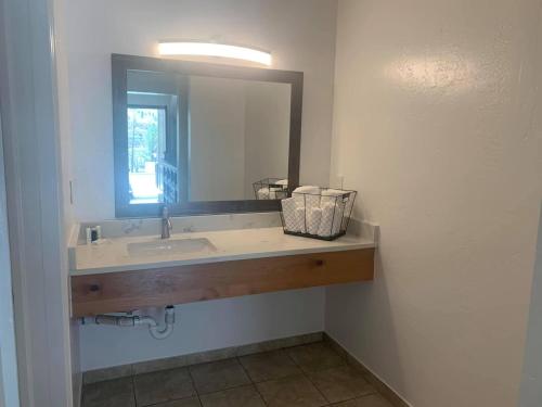 a bathroom with a sink and a mirror at Hanging Lake Inn in Glenwood Springs