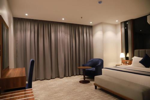 Katil atau katil-katil dalam bilik di Tulip View Hotel
