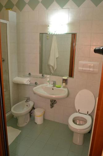 a bathroom with a toilet and a sink at B&B Ai Prati in Bergamo
