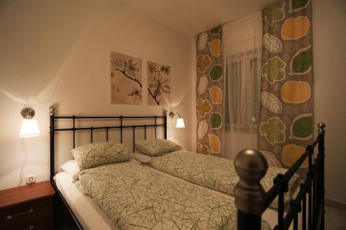 a bedroom with a bed and a shower at Villa Sonja in Zadar