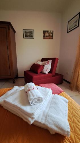Postel nebo postele na pokoji v ubytování La Casetta di Zia Palmina