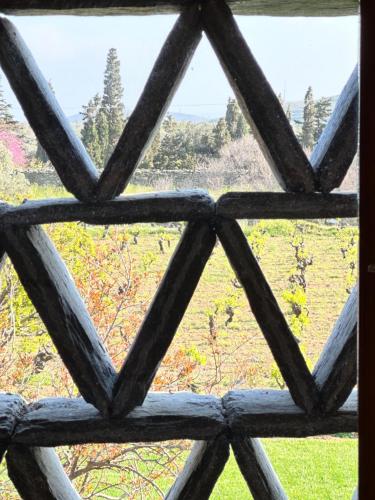 a view from a window looking out at a field at Peristerionas Estate in Karistos