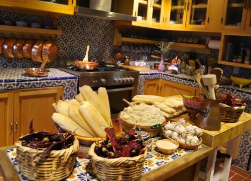 a kitchen with baskets of food on a counter at Boutique hotel and gallery in San Angel Inn in Mexico City