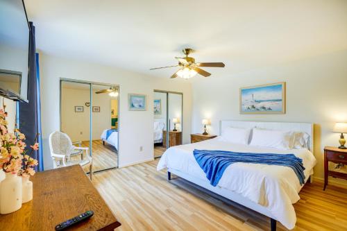 a bedroom with a large bed and a table at Kitty Hawk Vacation Rental 1 Mi to Beaches! in Kitty Hawk