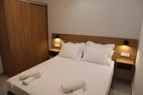 Ένα ή περισσότερα κρεβάτια σε δωμάτιο στο Kiani Apts