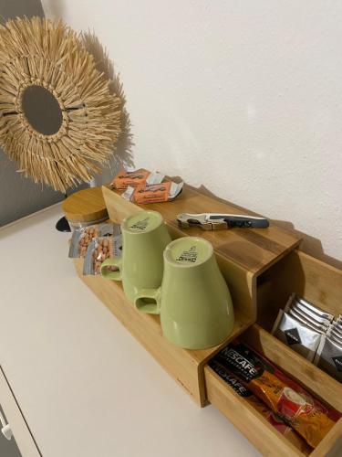 a wooden tray with two mugs on top of it at Ubytování na Lesní in Luhačovice