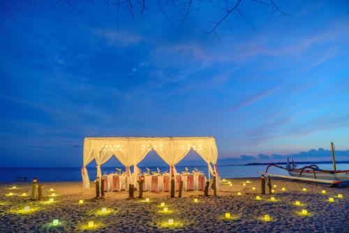 a wedding altar on the beach at night at Kayumanis Sanur Private Villa and Spa in Sanur