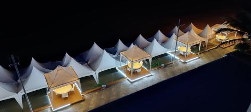 an overhead view of a row of tents at night at Apartment (Grand Diamond Beach) Tonsupa in Tonsupa