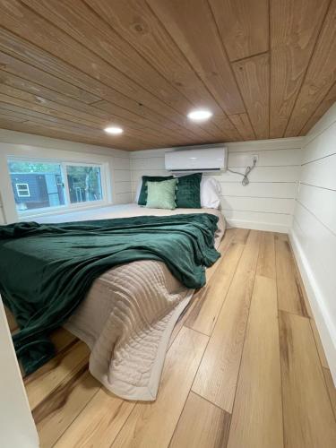 a bed in a small room in a tiny house at Tiny Islands Resort in Blanco