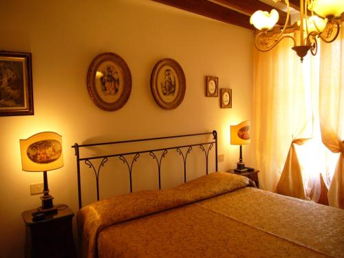 Cama o camas de una habitación en Mulino Di Quercegrossa