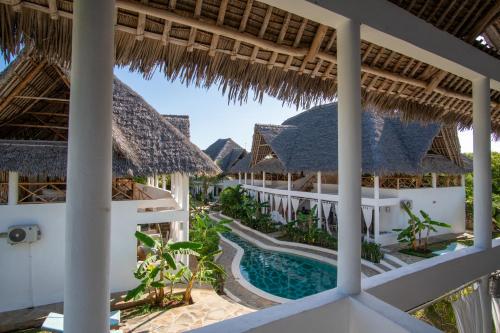an aerial view of a resort with a swimming pool at Rafiki Village in Watamu