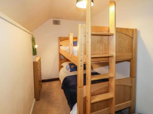 a room with two bunk beds in a room at 1 The Barn in Haverfordwest