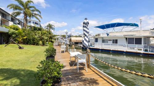 a boat is docked at a marina at Anchors Away - Waterfront Unit in Sandstone Point