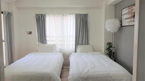 Cama o camas de una habitación en Sun Park Heights