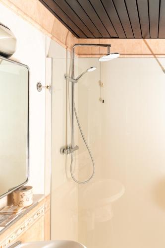a shower with a glass door in a bathroom at Hotel Valentino Centro Storico in Orvieto