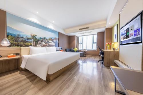 Ένα ή περισσότερα κρεβάτια σε δωμάτιο στο Atour Hotel Hefei Changjiang Road