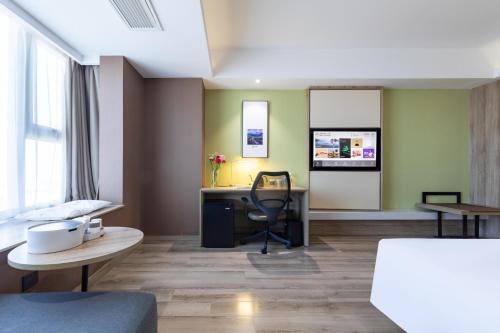 Ένα ή περισσότερα κρεβάτια σε δωμάτιο στο Atour Hotel Hefei Changjiang Road