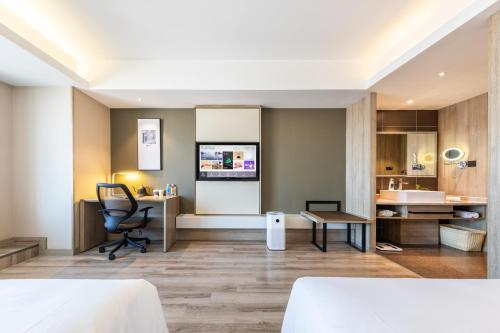 Μια τηλεόραση ή/και κέντρο ψυχαγωγίας στο Atour Hotel Hefei Changjiang Road
