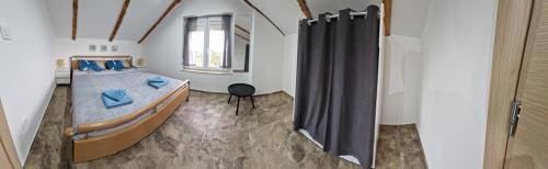 a bedroom with a bed and a window at Apartman Valja - 55m2 - Sea View - Garden - Grill in Jadranovo