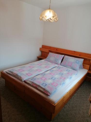 a bed in a room with at Ferienwohnungen Kail Thomas in Obsteig