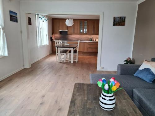 a living room with a couch and a table at Fløyen Townhouse in Bergen