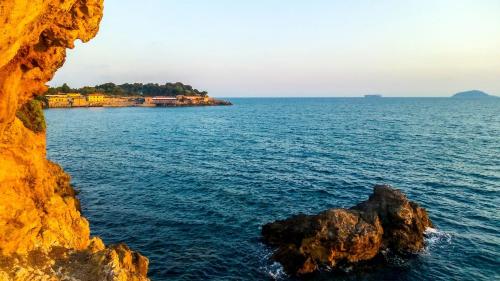 a view of the ocean from a cliff at 23Apartments in La Spezia