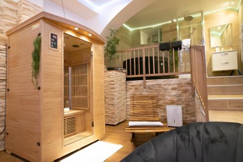 a large room with a sauna with a wooden at Le Spa de la Cathédrale - Jacuzzi - Sauna - Champagne - Netflix - Wifi in Troyes