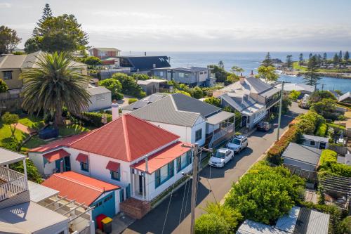 an aerial view of a small town with houses at Cosy coastal cottage- Allwood Harbour in Kiama