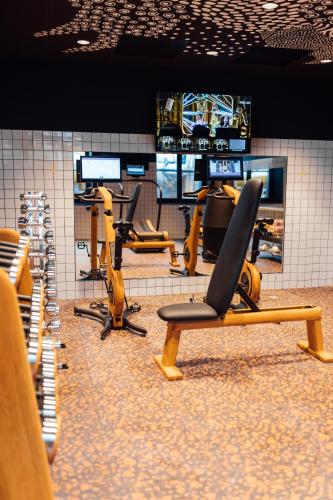 a gym with a row of chairs in a room at Mama Shelter Rennes in Rennes