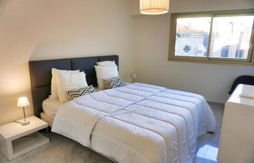 Кровать или кровати в номере LEM5D - Palmes d'Or Properties