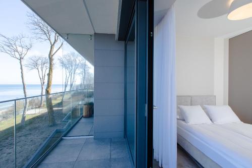 Postel nebo postele na pokoji v ubytování Resort Hevenia Rewal 9