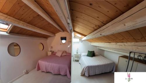 Postel nebo postele na pokoji v ubytování La Lupinella Apartment