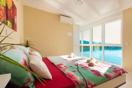 Ένα ή περισσότερα κρεβάτια σε δωμάτιο στο Villa Jasmin Posedarje