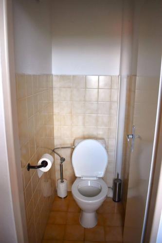 a bathroom with a white toilet in a stall at Penzion Era in Zlín