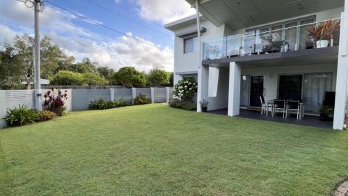 an image of a house with a yard at 1 - 5a Coochin Street, Dicky Beach - 200m To Beach in Caloundra