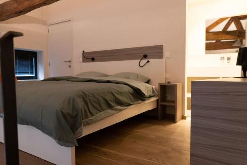 Una cama o camas en una habitación de Vakantiehuisje 't Goed Geluk