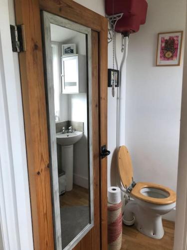 a bathroom with a toilet and a sink at Crossing Retreat - POOL table, PROJECTOR, BARN in Tunstead