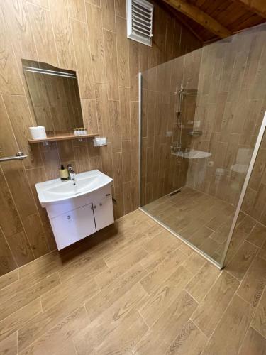 a bathroom with a sink and a shower at Cilek Butik Hotel in Cesme