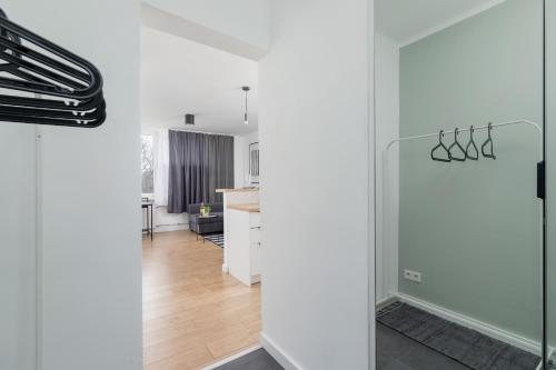 a room with a glass door leading to a kitchen at Pet-Friendly Cosy Studio Skarbińskiego by Renters in Krakow