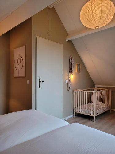 Katil atau katil-katil dalam bilik di Bohemian Wellness met hottub & sauna