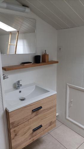 a bathroom with a sink and a bath tub at Maison T4 a 6 minutes à pieds de Sarlat in Sarlat-la-Canéda