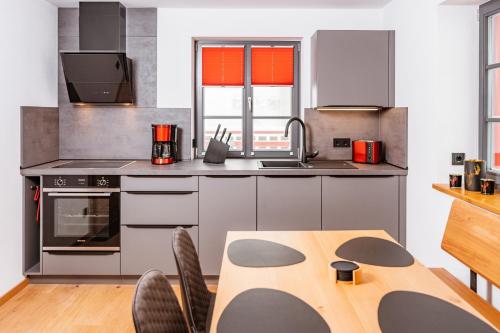 Kuchyň nebo kuchyňský kout v ubytování Zugspitze Apartement Morgen.Rot