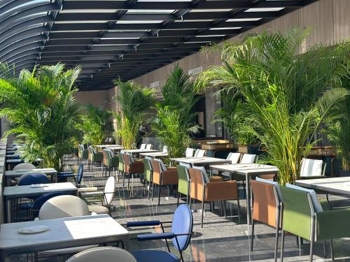 Ein Restaurant oder anderes Speiselokal in der Unterkunft Gao Shi Di Hot Spring Hotel Yangzhou 