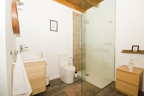 a bathroom with a toilet and a sink and a shower at Los Alonsos - Open Mall - By AZ Rentals in Arrecife
