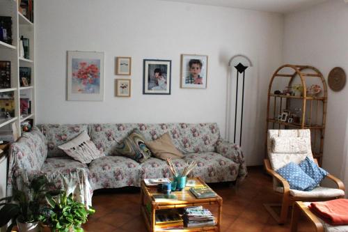 a living room with a couch and a table at Bencini Family in Montefiridolfi