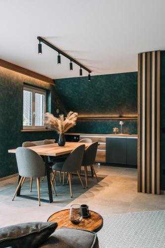 a dining room with a table and chairs at Guest House Pohorska Kavarna in Maribor