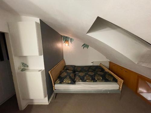 a small bed in a room with an attic at Vienna terraced Apartment in Vienna