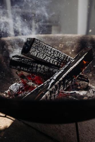 a grill with a keyboard and two phones on fire at Seehüüsli Suite / Lake House Suite in Berlingen